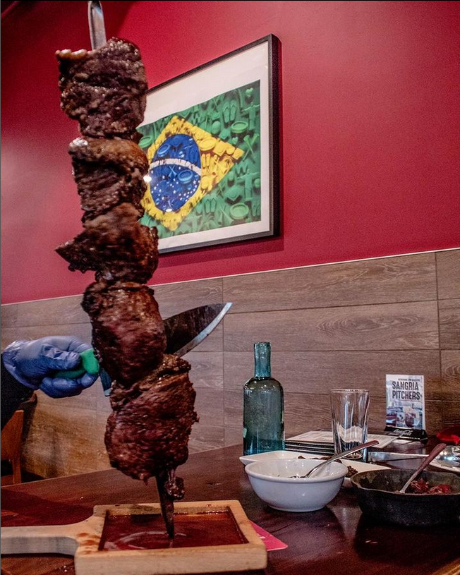 A Brazilian steakhouse with a river view